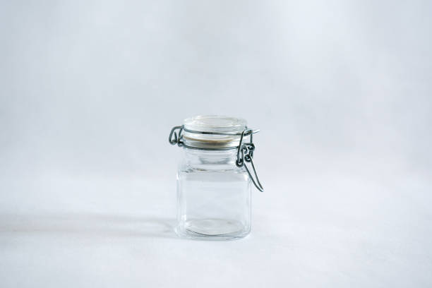 istock An empty closed glass jar with clip lid on a white background 693097818