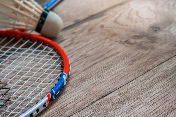 istock Close up racket badminton and shuttlecocks on  wooden background 693106452