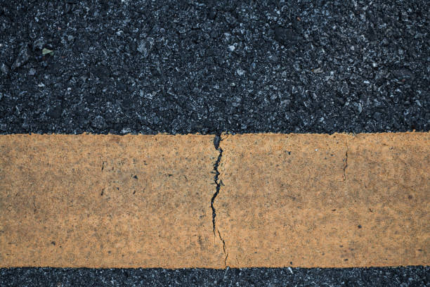 istock Asphalt road line yellow texture background. 693119704