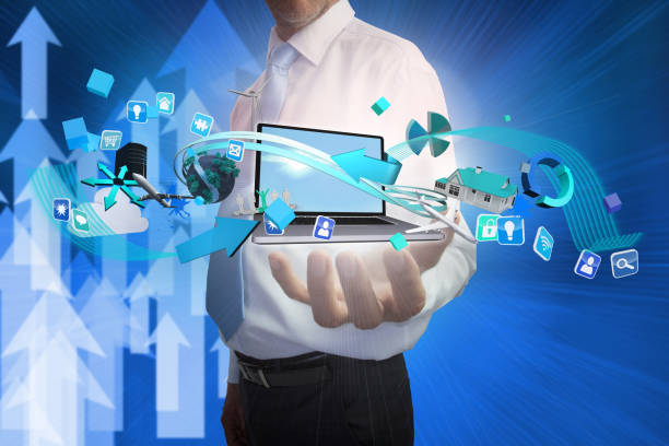 istock Businessman presenting app icons and laptop 693120098