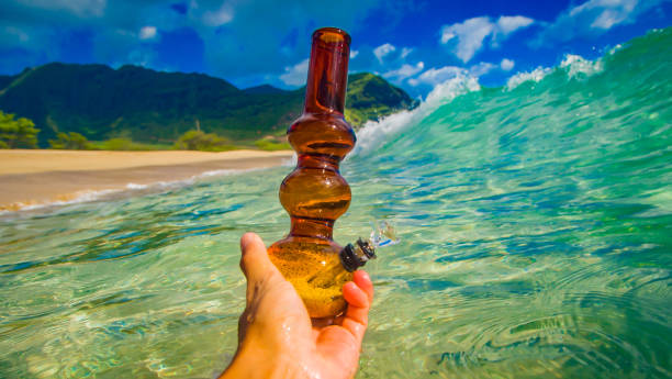 tilted bong on water stock photo