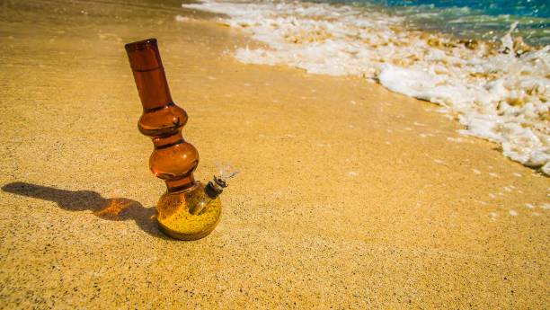 istock close up bong with waves on sand 693122846