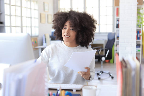 istock Smiling african businesswoman at workplace 693125466