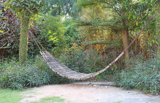 istock Old wood cradle in a garden. 693125866