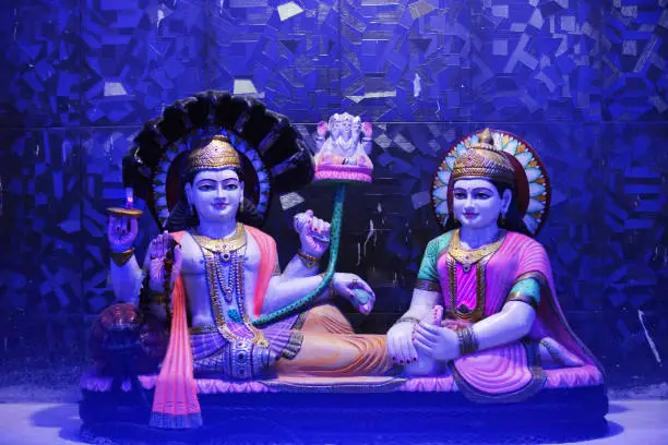 Lord Vishnu and Lakshmi sitting with Sheshnag and Lord Bharhama in the hindu temple.