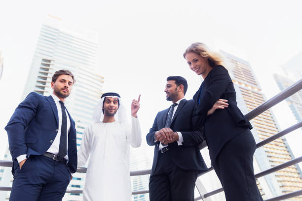 istock Arab businessman discussing work with his colleagues 693135636