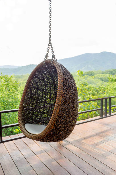 istock rattan lounge hanging chair writh white  pillow 693138706