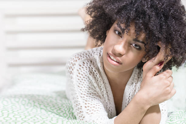 istock Beautiful girl with afro relaxing. 693146164