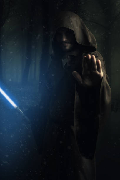 istock Mysterious warrior holding a lightsaber 693151574