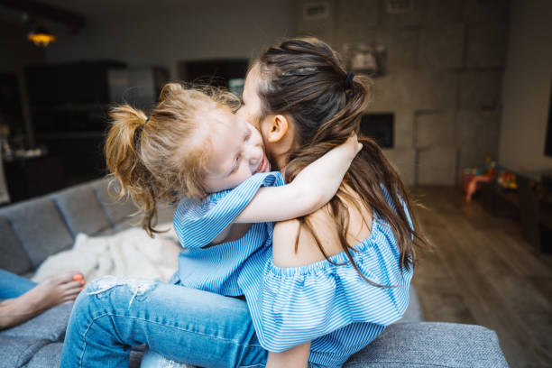 istock Elder and younger daughter on the big couch 693160536
