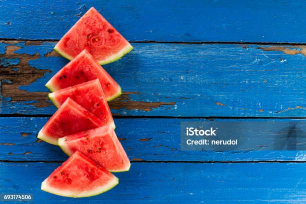 Sliced Watermelon Top View Many Slices On An Old Rustic Blue Table Side Composition With Copy Space Food Backrgound Stock Photo - Download Image Now
