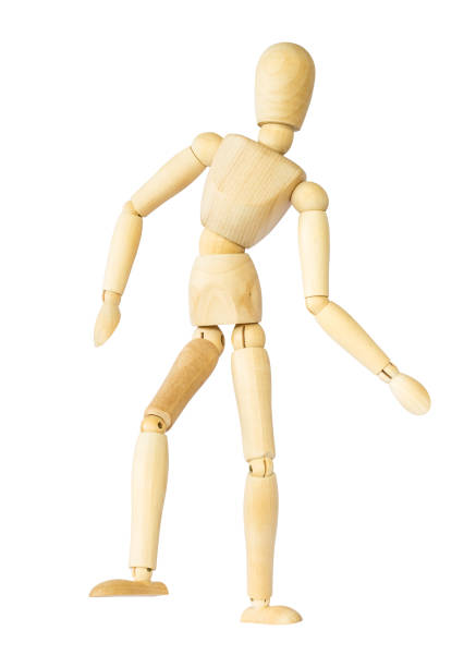 istock Wooden puppet is dancing . Isolated background . 693192514