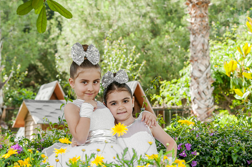 Turkish little sisters enjoying outdoors