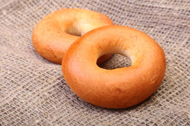 istock Fresh authentic New York style bagel isolated on Canvas cloth background 693196444