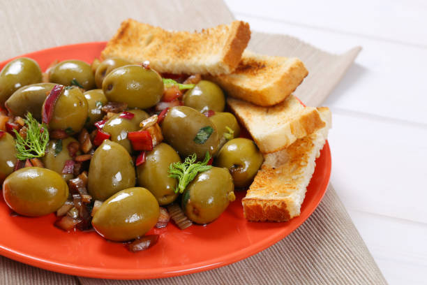 istock marinated green olives with toast 693204720