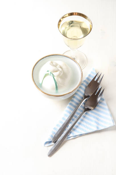 istock Italian fresh burrata cheese in a ceramic bowl. Light white background. 693204872