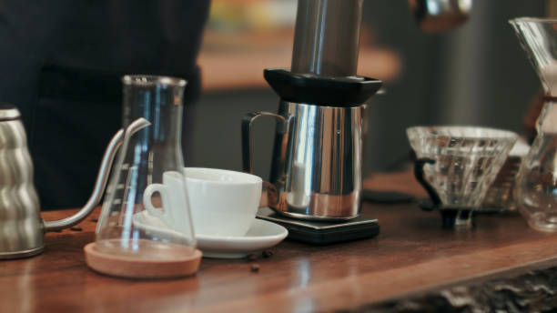 istock Barista pouring water on coffee ground with filter 693207948
