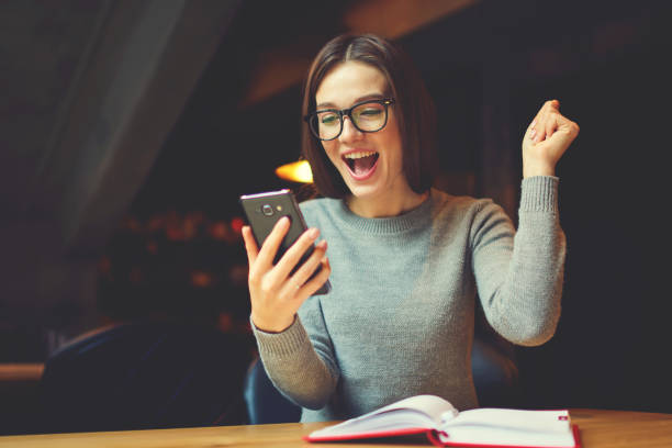 Emotional young attractive female expressing surprise