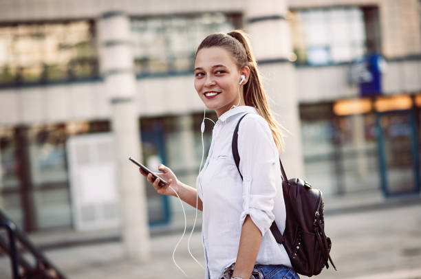 istock Busy young woman using smart phone 693216736
