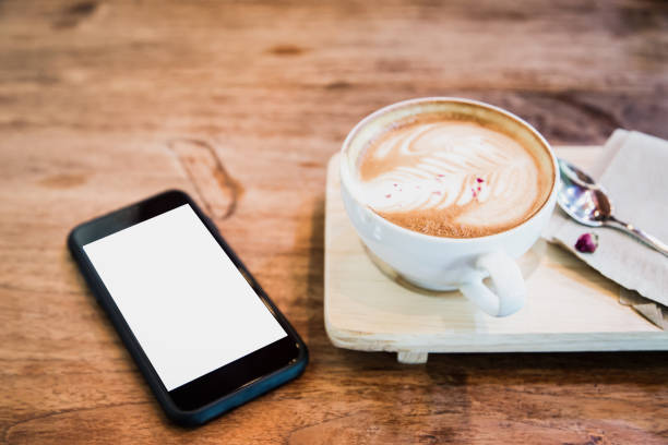 istock cup of coffee and mobile phone on  table 693222334