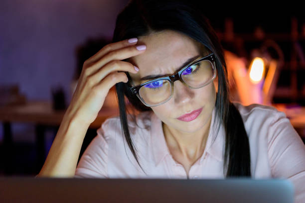 istock businesswoman looking on laptop in thoughtful pose 693227482