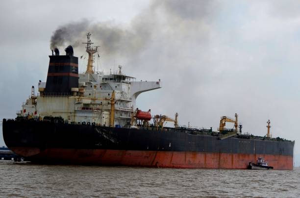 istock Big oil tanker during unloading operation in the sea 693238136