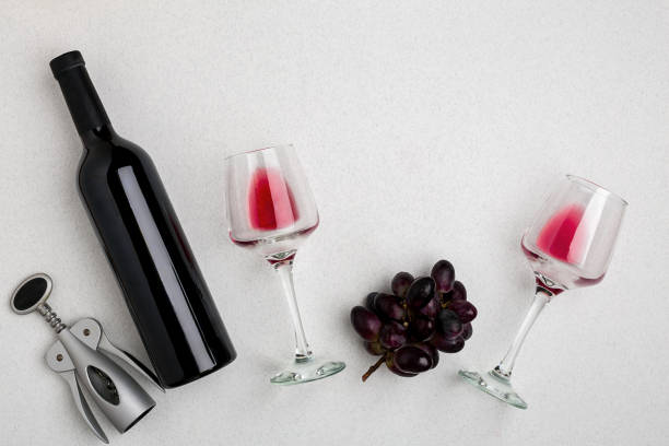 istock Red and white wine bottles and glasses, top view 693238264