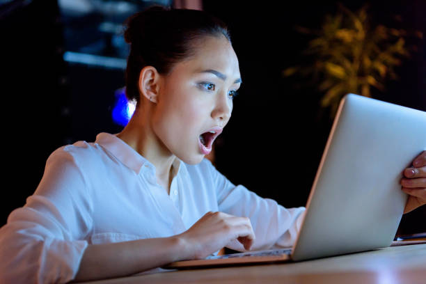 istock businesswoman working on laptop while sitting at table 693238520