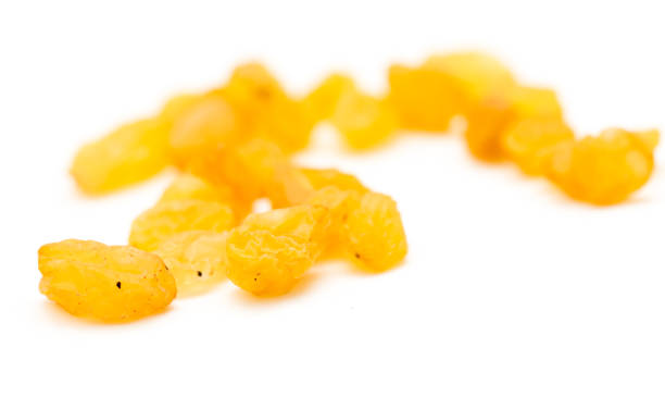 istock Golden raisins on a white background 693238628