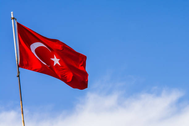 istock Turkey flag waving in the blue sky 693244272