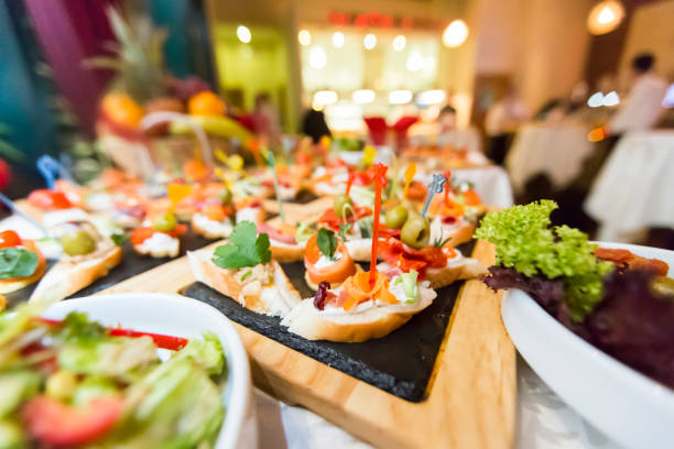 istock Beautifully decorated catering banquet table with different food snacks and appetizers 693247568