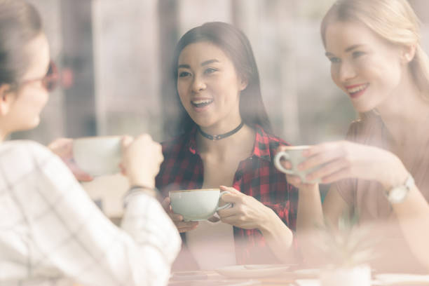 istock friends spend time together on coffee break in cafe 693247652