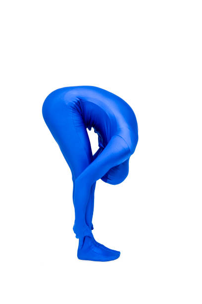 istock Mysterious blue man in costume doing yoga 693248442