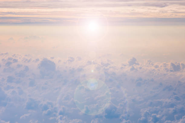 istock fluffy cloud on the sky and flare sunset time 693255832