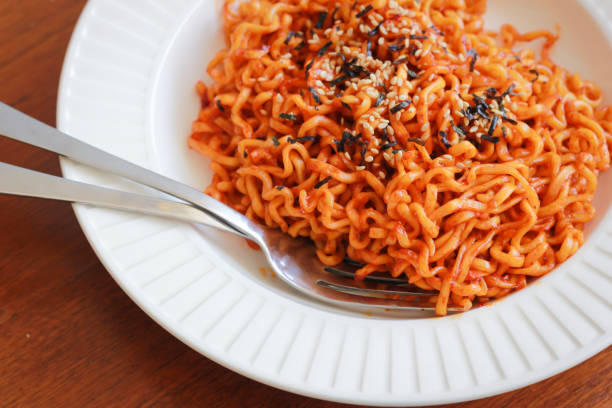 istock Spicy noodles sprinkle sesame seeds. 693256028