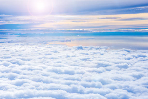 istock fluffy cloud on the sky and flare sunset time 693256134
