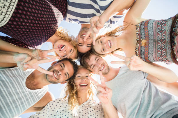 istock Group of friends forming a huddle 693256984