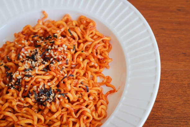 istock Spicy noodles sprinkle sesame seeds. 693259354