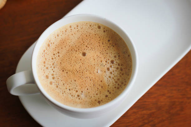 istock Coffee with white cup on wooden background 693264638