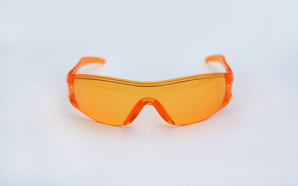 istock Orange safety glasses isolated on white background. 693269386
