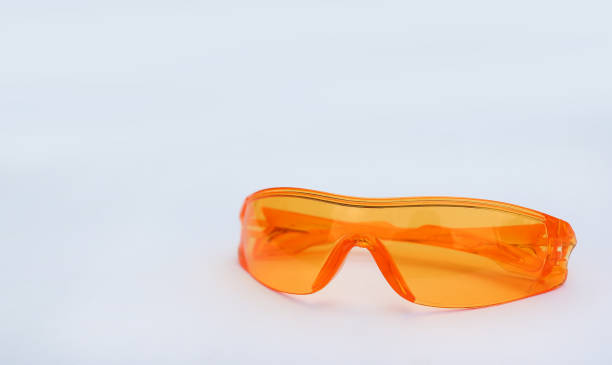 istock Orange safety glasses isolated on white background. 693269532