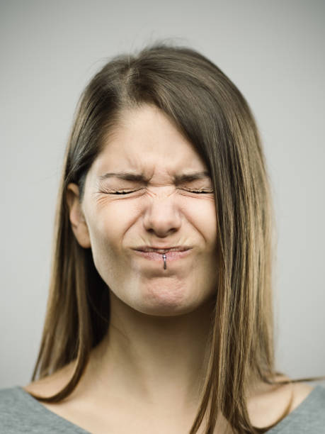 Real young woman with pain expression