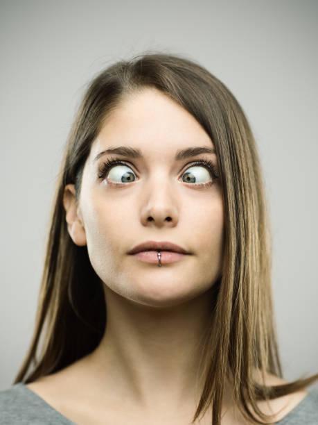 istock Real young woman with crossed eyes 693274014
