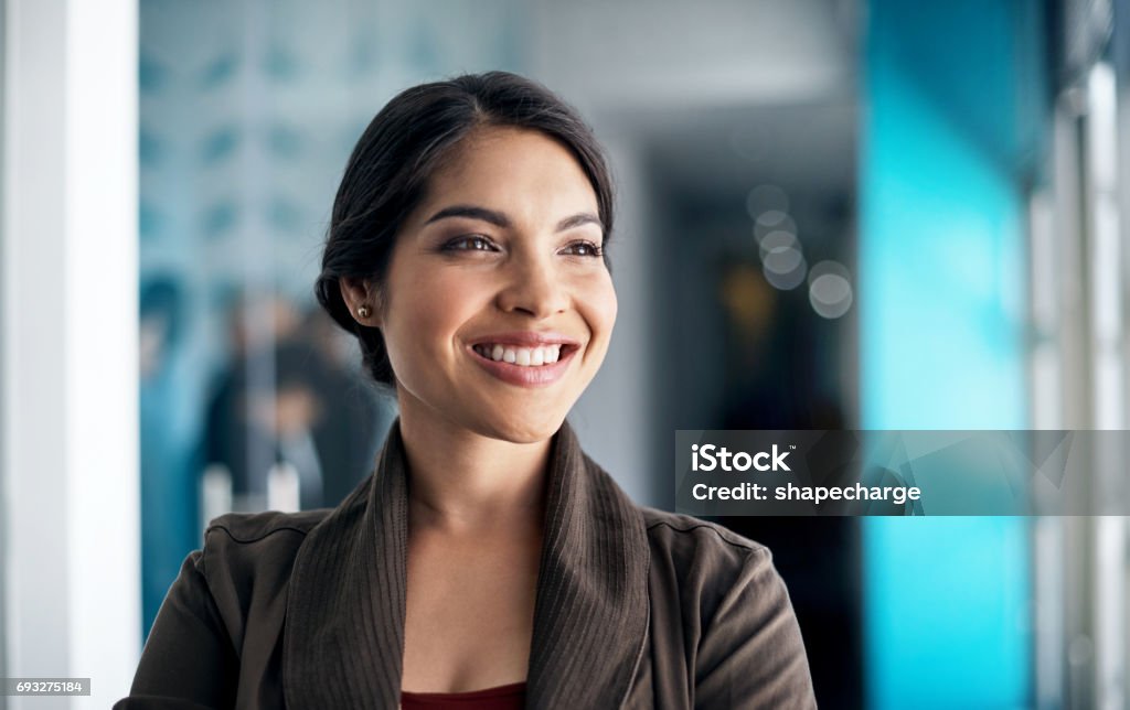 She has a multitude of qualities that many lack Cropped shot of a designer standing in a office Employee Stock Photo