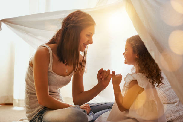 Lets make a promise Shot of a mother and daughter coming together and making a pinky swear as a promise to one another pinky finger stock pictures, royalty-free photos & images