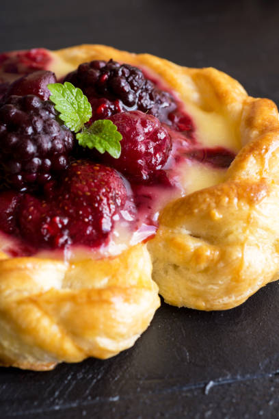 istock Vanilla Cream and Fruit Berry Puff Pastry Dessert on Dark Background 693278502