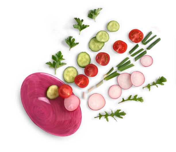 istock Vegetables from a plate on a wdhite backgroun 693279592