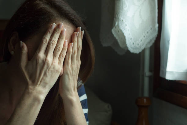 istock Woman covering her face. 693279898