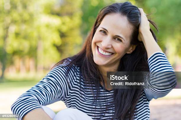 Laughing Mid Woman At Park Stock Photo - Download Image Now - Women, One Woman Only, Mature Women