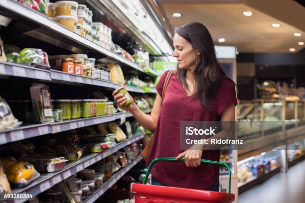Woman Shopping In Supermarket Stock Photo - Download Image Now - Supermarket, Shopping, Retail